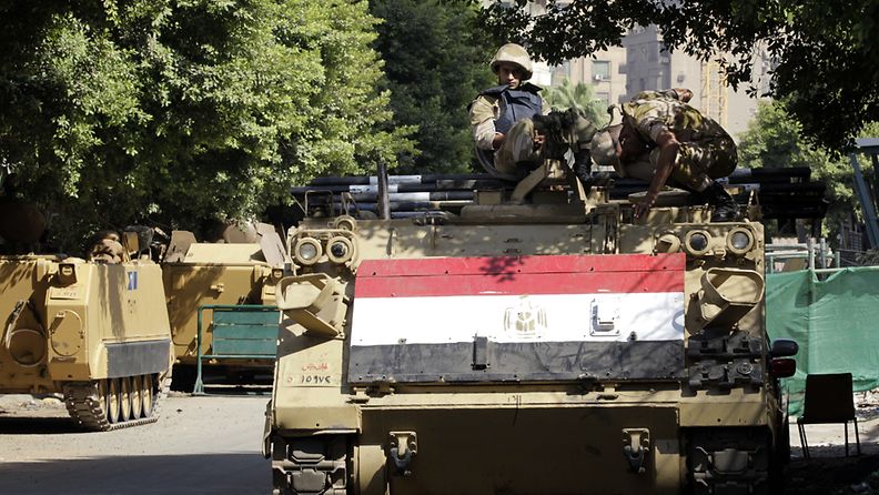 Egyptian army soldiers keep watch on top of an armoured vehicle at one of the streets leading to Tahrir square, one day ahead of the Yom Kippur War's 40th anniversary in Cairo, Egypt, 05 October 2013. A Brotherhood-led alliance has called on followers to march to central Cairo’s Tahrir Square on 06 October marking Army Day and the 40th anniversary of the 1973 Arab-Israeli war. Army supporters have also called for a massive rally in Tahrir the same day. 