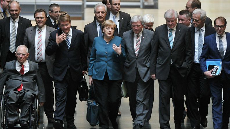 German Chancelloer Angela Merkel (C) arives with Finance Minister Wolfgang Schaeuble (L-R), Interior Minister Hans-Peter Friedrich, Chief of Staff Ronald Pofalla, Premier of Saxony Stanislaw Tillich, Premier of Hesse Volker Bouffier, Premier of Bavaria Horst Seehofer, CDU secretary general Hermann Groehe and Transport Minister Peter Ramsauer to the exploratory talks on the formation of a coalition the CDU/CSU and The Greens in Berlin, Germany, 15 October 2013