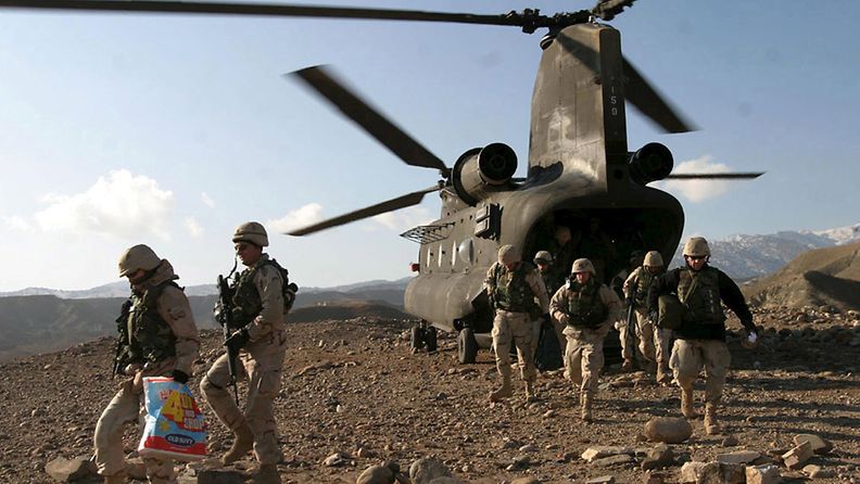 A file photograph dated 24 December 2004 shows US soldiers disembark a US CH-47 Chinook helicopter in Sarobi district to celebrate Christmas with Afghanis.