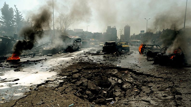 A handout photo made available by official Syrian agency SANA (Syrian Arab News Agency) shows a number of vehicles ablaze close to the site of a large explosion in the Syrian capital Damascus 21 February 2013. State media reported a 'terrorist explosion' which has claimed casualties. The blast occurred in the Mazraa district of the city