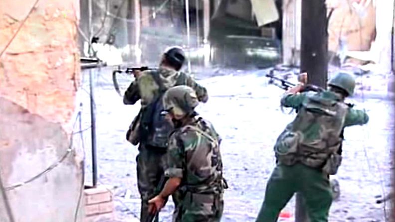 Uutistoimisto SANA:n välittämää televisiokuvaa Syyrian hallituksen sotilaista Aleppossa.