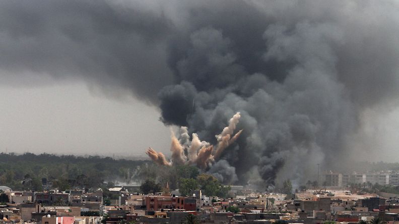 A file picture dated 07 June 2011 shows smoke rising in the sky after a NATO air strike in Tripoli, Libya.