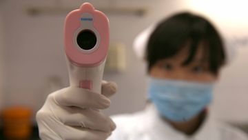  A nurse uses a body temperature detector in a hospital in Shanghai, China, 03 April 2013. Shanghai has activated an emergency response plan following the two deaths of the H7N9 strain of bird flu.