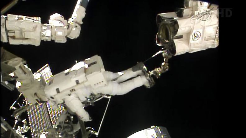 A frame grab from NASA TV shows Italian Air Force pilot and European Space Agency astronaut Luca Parmitano (Top) and NASA astronaut Chris Cassidy of the US (Bottom) during a space walk outside the International Space Station on 09 July 2013. The astronauts were scheduled to spend more than six hours preparing the space station for the installation of a Russian module and other tasks. Parmitano is the first Italian astronaut to walk in space according to NASA. 