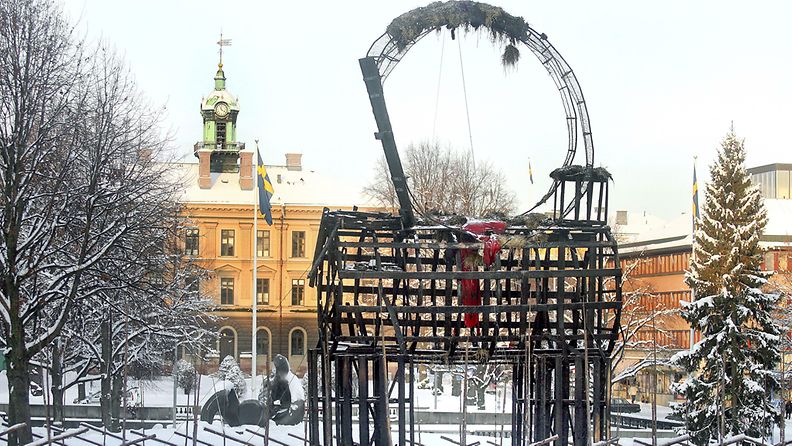 The charred remains of a Christmas straw goat stands in the town center of Gavle, Northern Sweden, on Dec. 23, 2009. Torching the goat has become a yuletide tradition, in spite of surveillance cameras and security guards the 43-foot-high (13-meter-high) goat has burned 24 times since it was first set up in 1966 to mark the holiday season. EPA/