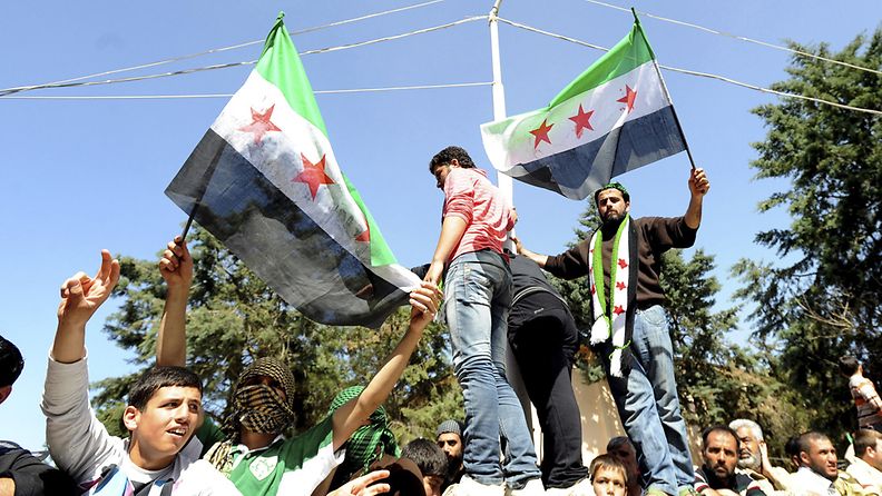 Syyrian pakolaiset osoittavat mieltään maan presidenttiä Bashar al-Assadia vastaan. 