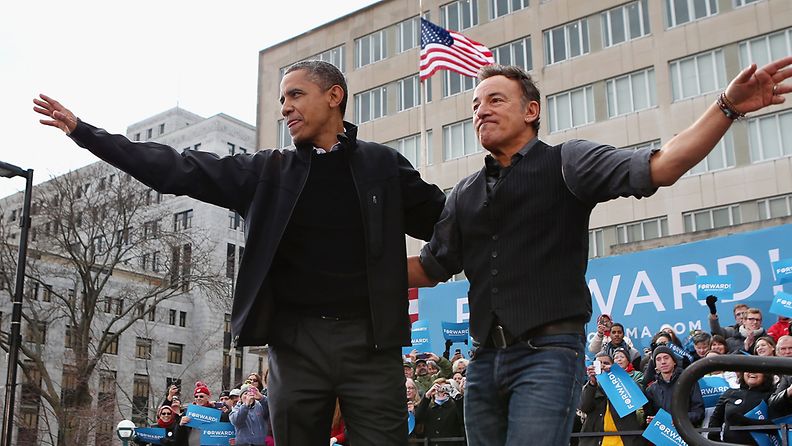 MADISON, WI - NOVEMBER 05: Rocker Bruce Springsteen (L) welcomes U.S. President Barack Obama to the stage during a rally on the last day of campaigning in the general election November 5, 2012 in Madison, Wisconsin. Obama and his opponent, Republican presidential nominee and former Massachusetts Gov. Mitt Romney are stumping from one 'swing state' to the next in a last-minute rush to persuade undecided voters.