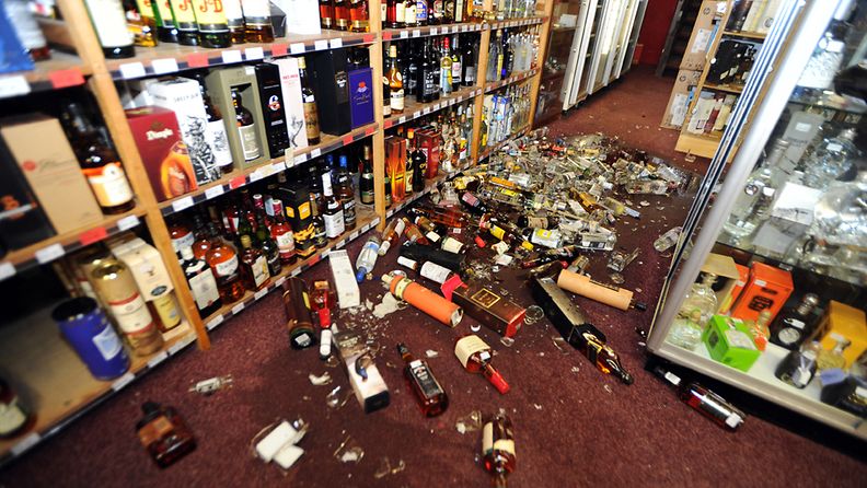 Broken bottles litter the floor of a wine and spirits store following a magnitude 6.5 earthquake, in Wellington, New Zealand, July 21, 2013. The quake, which hit about 5.10pm local time was centred 20km east of Seddon in the Cook Strait at a depth of 17km. 