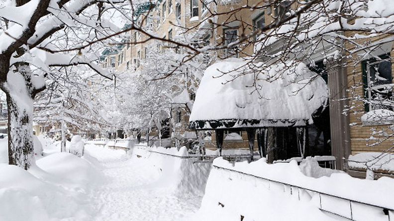 A snow covered sidewalk on Commonwealth Avenue is shown on February 9, 2013 in Boston, Massachusetts. The powerful storm has knocked out power to 650,000 and dumped more than two feet of snow in parts of New England. (Photo by Jared Wickerham/Getty Images   