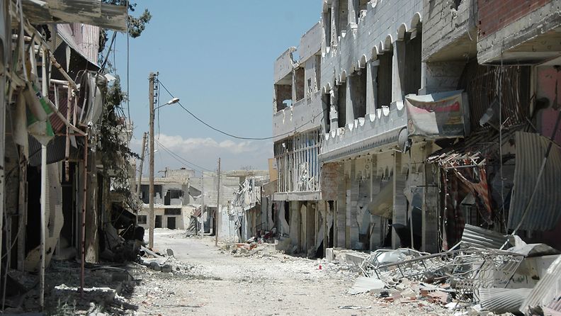 A general view shows damaged buildings in Qusair city, Homs province in central Syria, 05 June 2013, after the Syrian soldiers seized total control of the city and the surrounding regions. The Syrian army, backed by Hezbollah regained control of the strategic town of Qusair following weeks of heavy fighting, state media and the opposition reported. The town, near the Lebanese border, has been the scene of fierce fighting for more than two weeks. Activists say fighters from al-Assad's allies across the border and rebel groups from northern and eastern Syria were drawn into the battle. 
