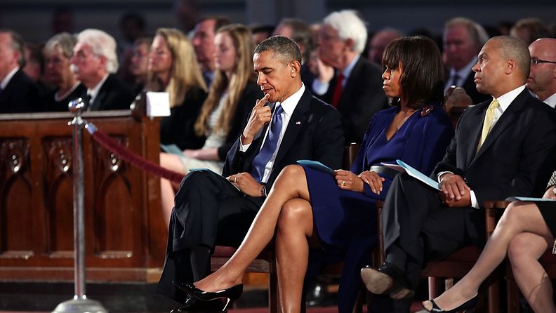 Yhdysvaltain presidentti Barack Obama ja puoliso Michelle Bostonin pommi-iskujen uhrien muistotilaisuudessa 18.4.2013.