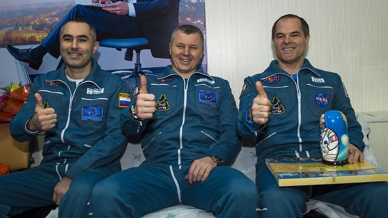 Expedition 34 Russian Flight Engineer Evgeny Tarelkin, Russian Soyuz Commander Oleg Novitskiy and Flight Commander Kevin Ford of NASA sitting together at the Kustanay Airport a few hours after they landed near the town of Arkalyk, Kazakhstan, 16 March 2013