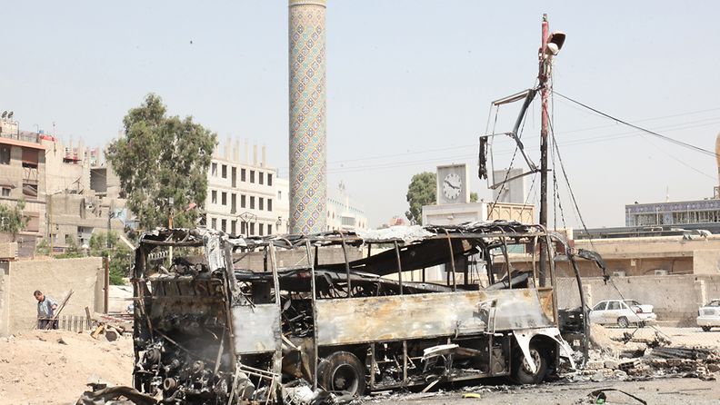 Autopommin tuhoja Syyrian Damaskoksessa kesäkuussa 2012.