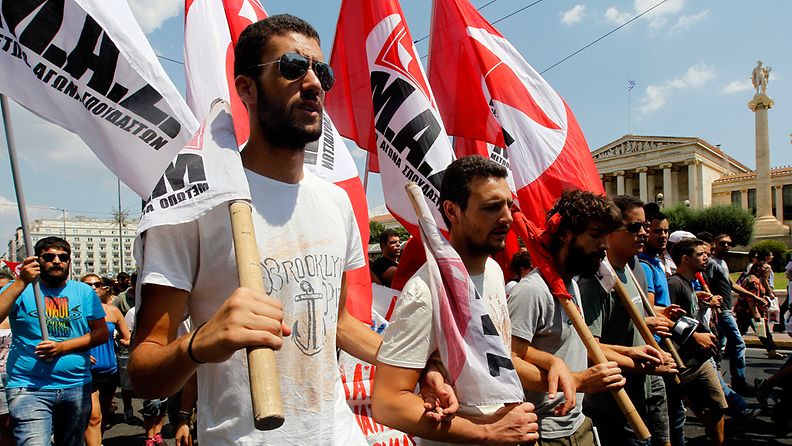 Public sector employees protest in front of the Parliament building during a general strike rally, in Athens, Greece, 16 July 2013. 