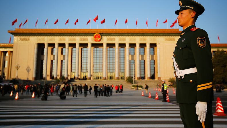 Security guards watch from the wings at the opening ceremony of the 18th CPC (Communist Party Congress) at the Great Hall of the People in Beijing, China 08 November 2012. The CPC is expected to introduce the new leadership lineup and the Standing Committee of the Politburo. 