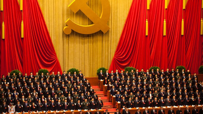 Delegates rise during the national anthem at the opening ceremony of the 18th CPC (Communist Party Congress) at the Great Hall of the People in Beijing, China 08 November 2012. The CPC is expected to introduce the new leadership lineup and the Standing Committee of the Politburo.