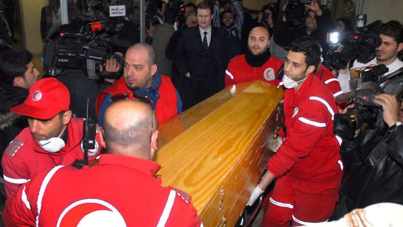 A handout photograph released by the Syrian Arab News Agency (SANA), staffers of the Red Crescent carrying the coffin of US journalist Marie Colvin, during the handover of her body along with the body of French journalist Remi Ochlik, at al-Assad University Hospital in Damascus, Syria, 03 March 2012. The Syrian government claimed that it found the bodies of the two journalists, who were killed in a rocket attack on a make-shift press centre, at the flashpoint neighborhood of Baba Amr in central Syria on 01 March. The bodies were transferred overnight to the Hospital in Damascus for DNA test before handing them over to the French and Polish ambassadors in Syria.