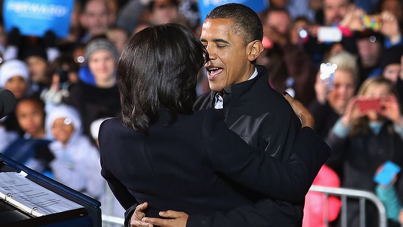 DES MOINES, IA - NOVEMBER 05: U.S. President Barack Obama embraces first lady Michelle Obama during his last rally the night before the general election November 5, 2012 in Des Moines, Iowa. The rally was held just outside Obama's first headquarters from the 2008 campaign, where his first march to the White House started. Obama and his opponent, Republican presidential nominee and former Massachusetts Gov. Mitt Romney are stumping from one 'swing state' to the next in a last-minute rush to persuade undecided voters.