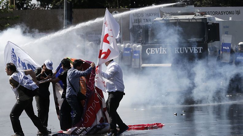 Turkish riot police use tear gas and water cannon against protestors during the May Day rally in Istanbul, Turkey 01 May 2013. Turkish police and protesters clashed in central Istanbul on 01 May after authorities moved to prohibit traditional Labour Day rallies at Taksim Square. Police used water cannons and tear gas against the demonstrators near Taksim Square. Witnesses reported clashes in several neighbourhoods in the area.