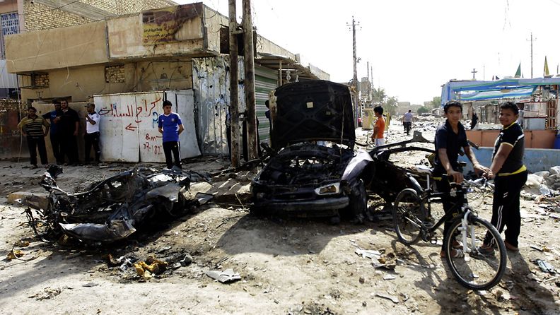 Iraqis inspect the site of a bomb attack in Husainiya town, north east of Baghdad, Iraq, 25 June 2013. Media reports state that at least 39 people were killed and 80 wounded in a series of bombings in several areas of Baghdad late 24 June 2013. EPA/AHMED ALI