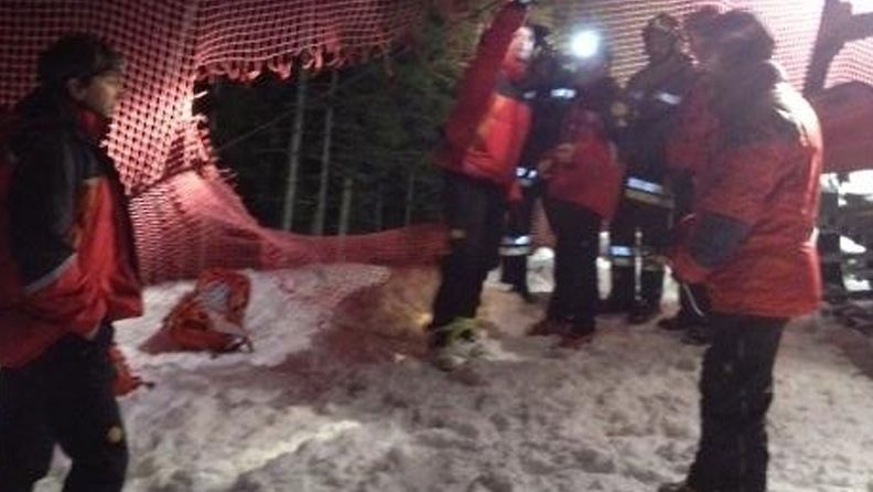 A handout photo released by the Italian mountain rescue organization Soccorso Alpino on 05 January 2013 shows rescuers of the Italian Alpine rescue in action on Mount Cermis where six Russian tourists died after an accident with their snowmobiles, near Cavalese, 05 January 2013. Two more tourists are severly injured