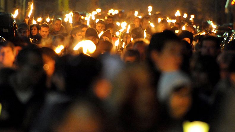 People take part in a torchlight procession for earthquake victims in L'Aquila, Italy, 05 April 2010 on the eve of the first anniversary of the devastating earthquake that hit the region on 06 April 2009.