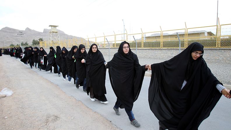 Iranian female students form a human chain, around the uranium conversion plant in Isfahan, to protest against the possible military threat by Israel in the city of Isfahan, central Iran, 15 November 2011. 