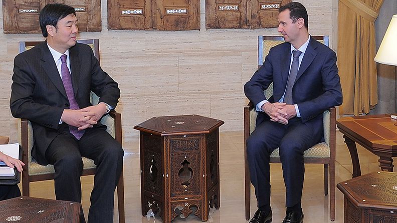 A handout photograph released by the Syrian News Agemcy SANA shows Syrian President Bashar Assad meeting with Chinese deputy foreign minister, Zhai Jun, at Tishrin Palace in Damascus, Syria on 18 February 2012.