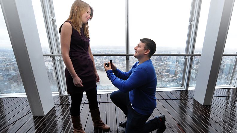 ames Episcopou, 22 from Essex, gets on one knee to propose to his long time girlfriend Laura Taylor, 22, also from Essex following the opening of The Shard in London, Britain, 01 February 2013. Laura said 'Yes'. The London Mayor Boris Johnson earlier cut a ribbon at 244 meters above the capital to welcome visitors to Europe's tallest building.