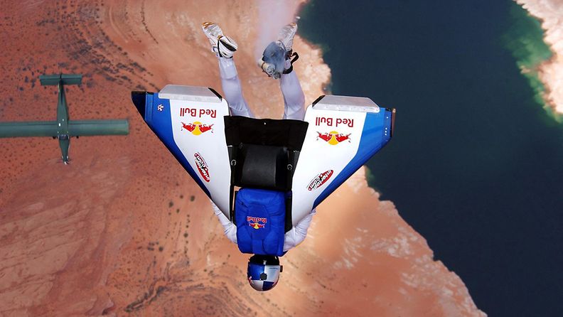 Austrian extreme sky-diver Felix Baumgartner is airborne as he flies in a man-against-machine race through the skies above Lake Powell on the Utah-Arizona border with a carbon wing strapped to his back as part of the 'Taurus World Stunt Award'.
