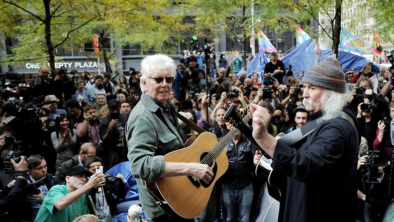 British singer-songwriter Graham Nash (L) and US singer-songwriter David Crosby (R) perform a small concert in Zuccotti Park at the Occupy Wall Street encampment in New York, New York, USA, 08 November 2011.
