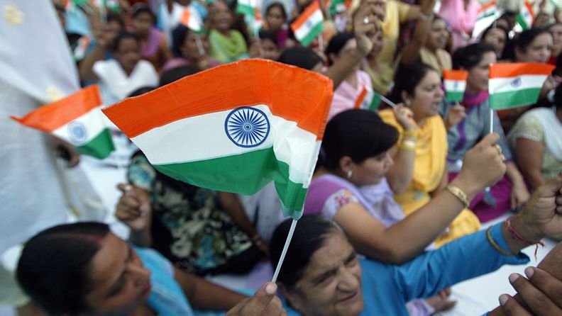 Women activists of Bhartiya Janta Party (BJP) hold Indian flags as they take part in a protest against the Indian government and in support of social activist, Anna Hazare after his arrest in New Delhi, in the northern Indian city of Amritsar, 16 August 2011. 