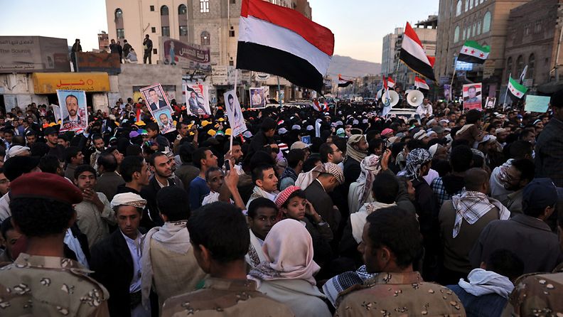 Yemeni soldiers block protesters during a march demanding the restructuring of the military and security units in Sana'a, Yemen, 06 December 2012. Reports state thousands of Yemenis took to the streets in Sana'a to demand the major restructuring of their country's military and security services, which suffer a high number of defections, as well as the ousting of former president Ali Saleh's relatives who control most of the military and security agencies.