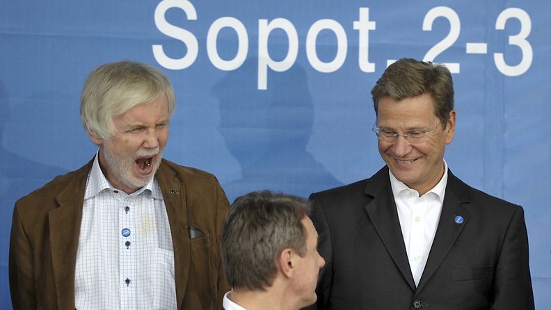 Finland's Foreign Minister Erkki Tuomioja (L) yawns as with German Foreign Minister Guido Westerwelle (R) they pose for a family photo at the informal meeting of EU foreign ministers starts in the Baltic resort of Sopot, Poland, 02 September 2011