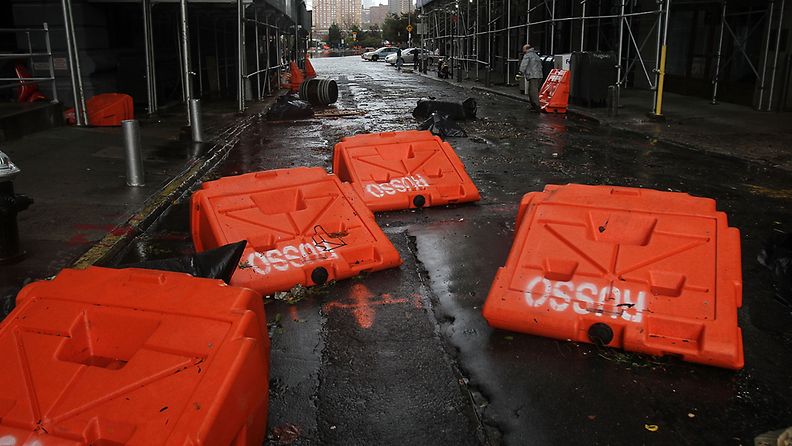NEW YORK, NY - OCTOBER 30: Portable upended flood dikes are viewed on a flooded street in the Dumbo section of Brooklyn after the city awakens to the affects of Hurricane Sandy on October 30, 2012 in New York, United States. At least 15 people were reported killed in the United States by Sandy as millions of people in the eastern United States have awoken to widespread power outages, flooded homes and downed trees. New York City was his especially hard with wide spread power outages and significant flooding in parts of the city. (Photo by Spencer Platt/Getty Images) 