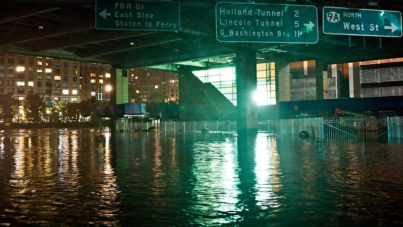 NEW YORK, NY - OCTOBER 29: A flooded street, caused by Hurricane Sandy, is seen on October 29, 2012, in the Financial District of New York, United States. Hurricane Sandy, which threatens 50 million people in the eastern third of the U.S., is expected to bring days of rain, high winds and possibly heavy snow. New York Governor Andrew Cuomo announced the closure of all New York City will bus, subway and commuter rail service as of Sunday evening. (Photo by Andrew Burton/Getty Images) 
