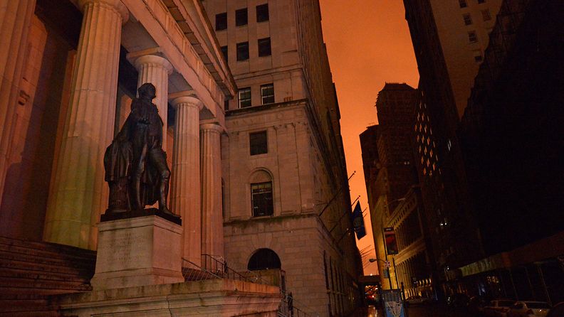 A view of a statue of George Washington on Wall Street after Hurricane Sandy left most of lower Manhattan without power in New York, New York, USA, 30 October 2012. The storm is one of the largest to hit the region in decades and threatens to cause massive problems for millions of people. EPA/JUSTIN LANE