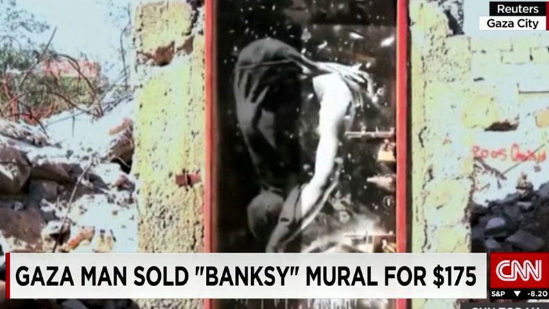 Katutaiteilija Banksyn maalaama ovi Gazassa. Kuvakaappaus CNN:n videosta.
