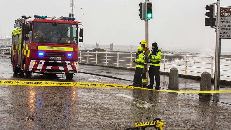 Security personnel stand guard on the seashore in Dublin, Ireland, March 2, 2018. Local meteorological department on Friday warned of possible flooding along the east and south coasts of Ireland following a heavy snowstorm that has hit the country for the third successive day.