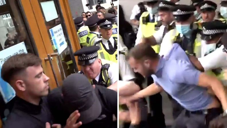 Rokotevastustajat yrittivät murtautua terveysvirastoon Lontoossa – videolle tallentunut tilanne kärjistyi poliisin ja aggressiivisen joukon käsirysyksi