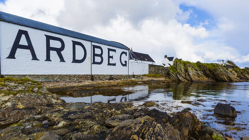 Ardbeg whisky distillery's established in 1815. The traditional white painted building with black inscription of the brand's name on it.