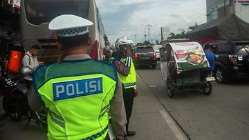 AOP: Indonesia, poliisi, liikenne 23.12.2023