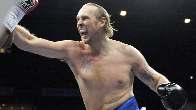 Finland's Robert Helenius lands a punch during his fight against Great Britain's Dereck Chisora during their heavyweight class European Championship professional boxing match at the "Night of the Heavyweights" event in Helsinki, Finland, on December 3rd, 2011.